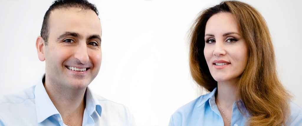 Portraitbild mit Dr Michel Chraim links und Dr. Elissa Harik-Chraim rechts, beide schauen nach vorne